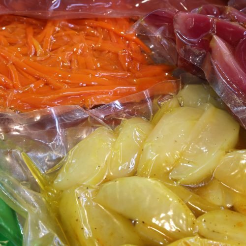 carrots apples pears and other fruits are vacuum packaged in special hermetic containers